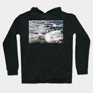 Seagulls flying over the crashing waves, Seahouses, Northumberland, UK Hoodie